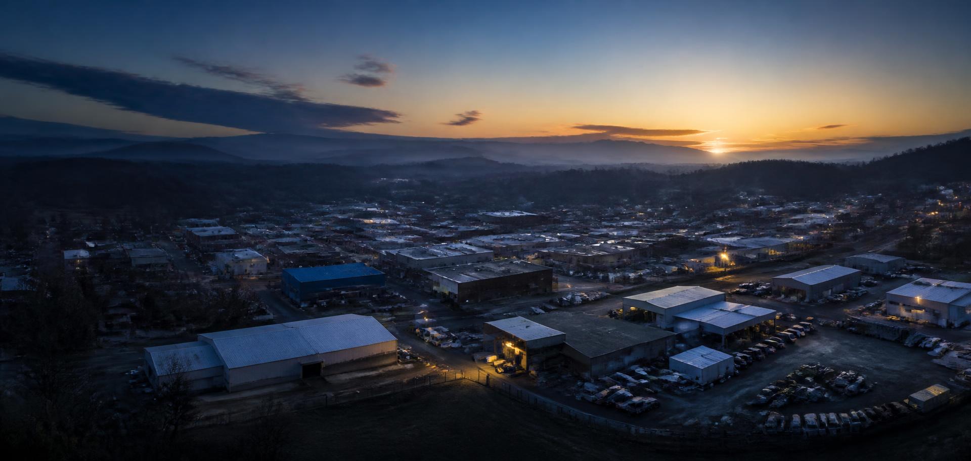 Aerial view at dawn of a small American town's warehouses and service yards